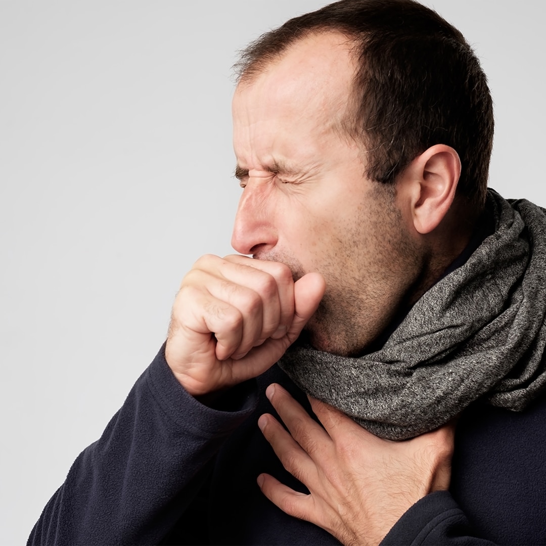 sick man coughing