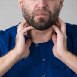 person with sore throat