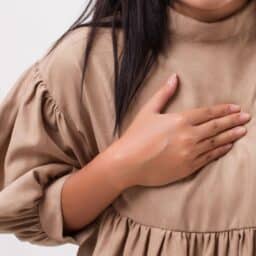 Person pressing on their chest