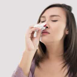 person with nosebleed