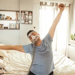 Man Wearing CPAP Machine for Sleep Apnea.